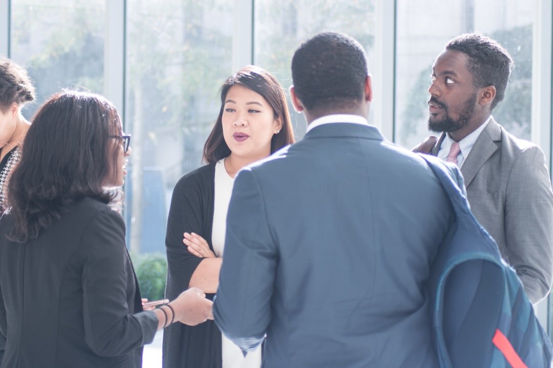 Business professionals networking and shaking hands at a conference