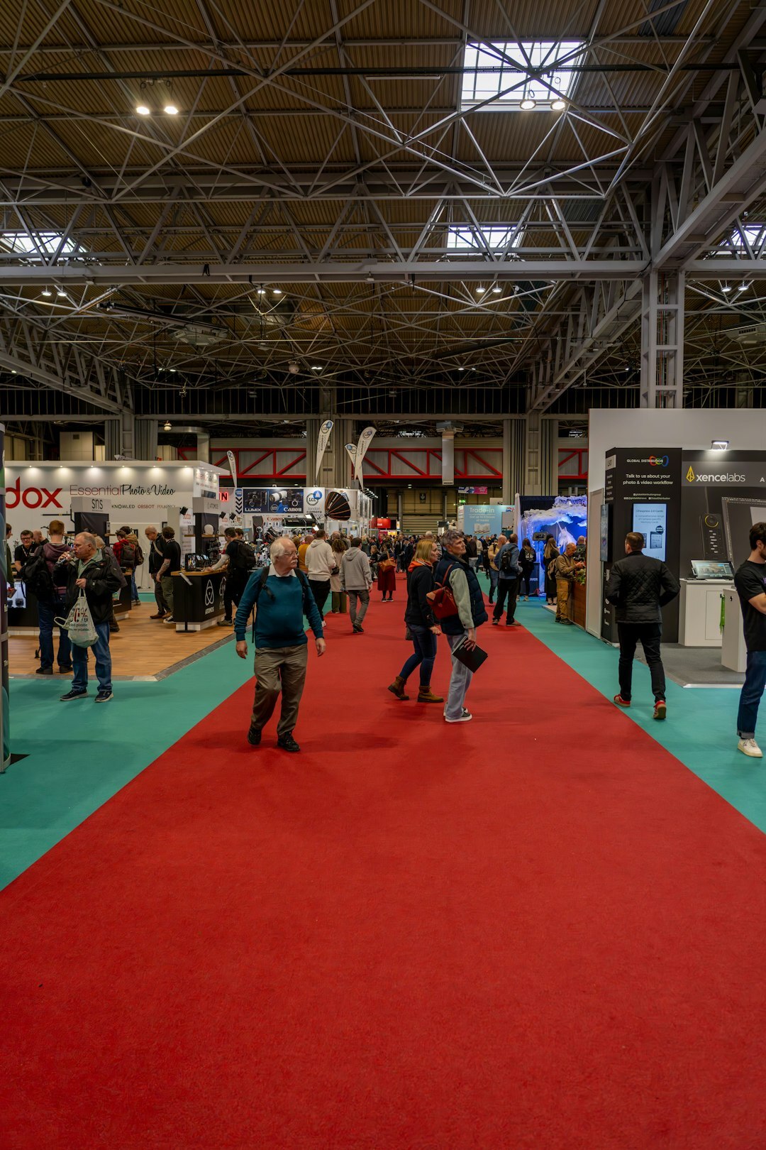 Large business exhibition hall filled with visitors and stands